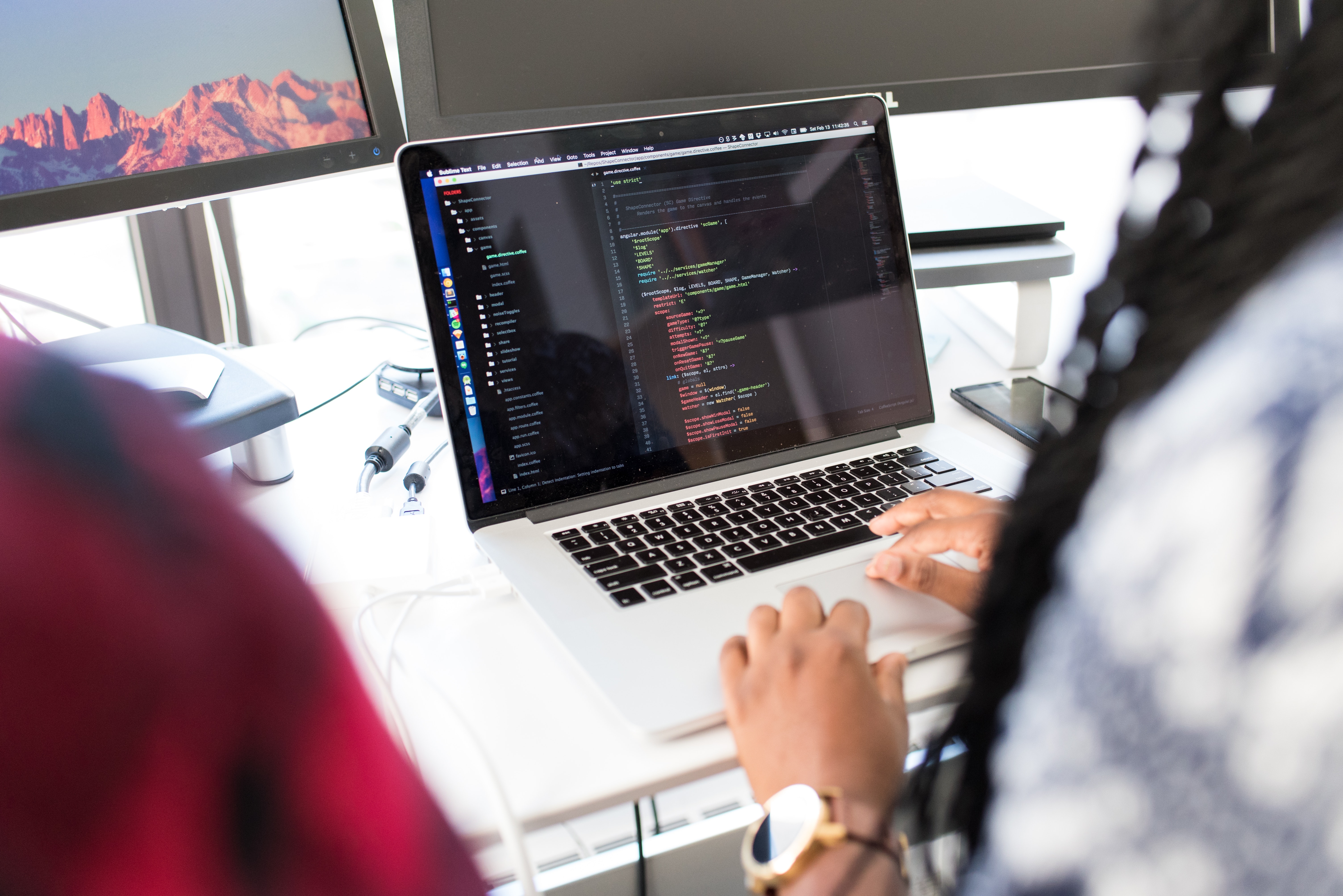 a women coding on a laptop